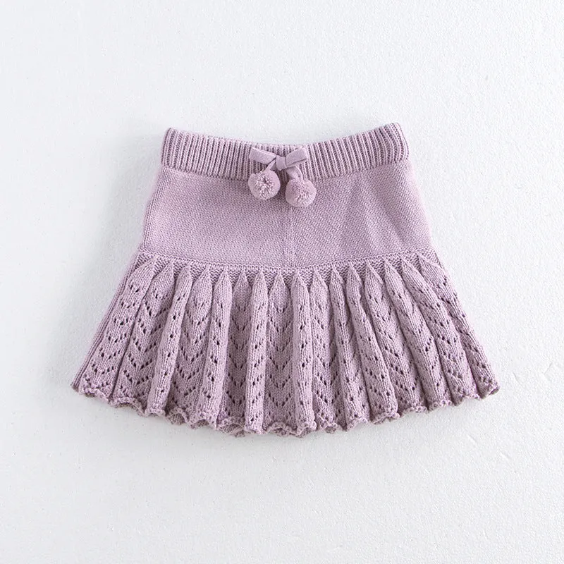 Girls hollow retro pleated pantskirt in light gray purple cotton, front view, on child of about 90cm height
