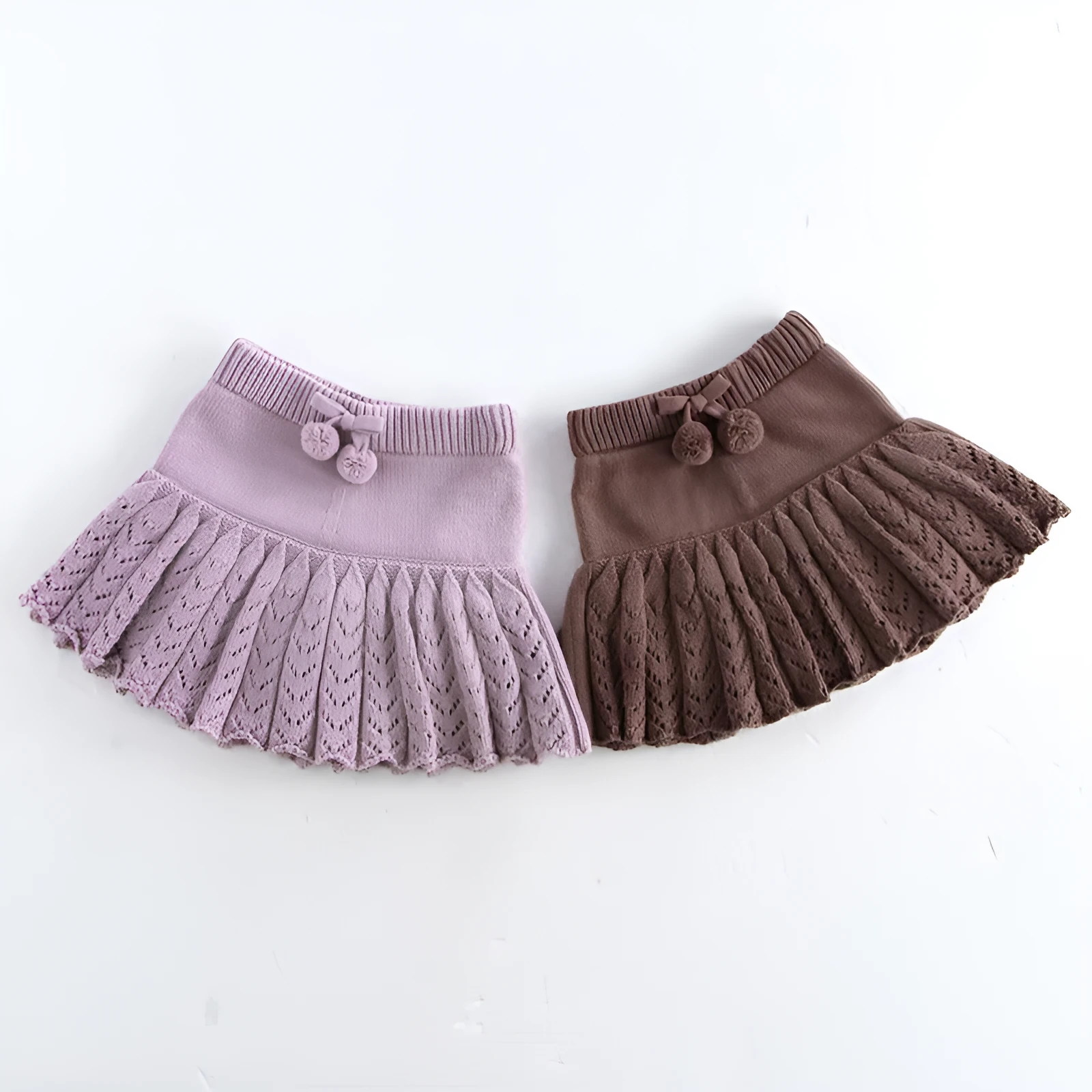 Girls hollow retro pleated pantskirt in light gray purple cotton, front view, on child of about 90cm height