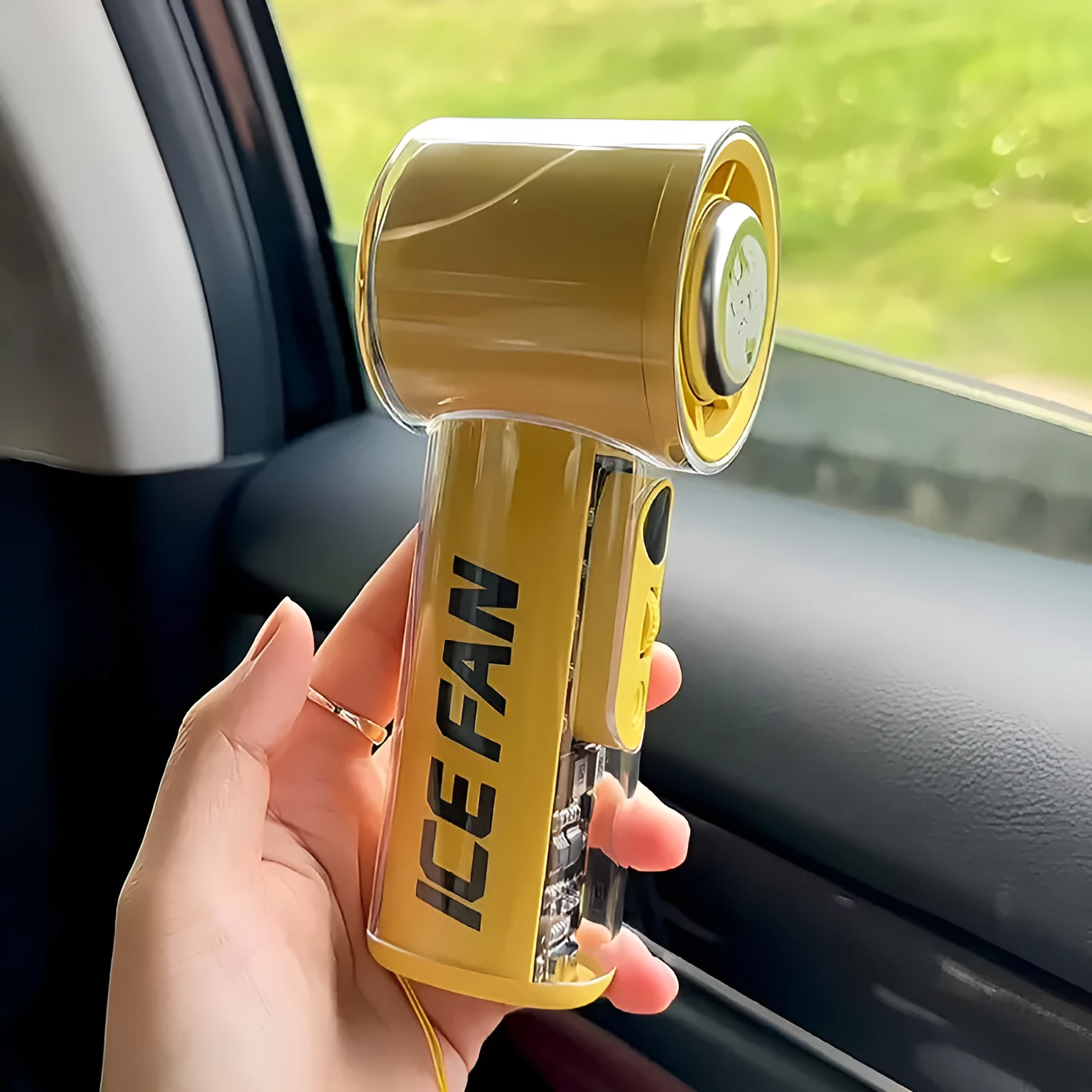 Handheld cooling fan with ice compress function in black, white, or yellow colours