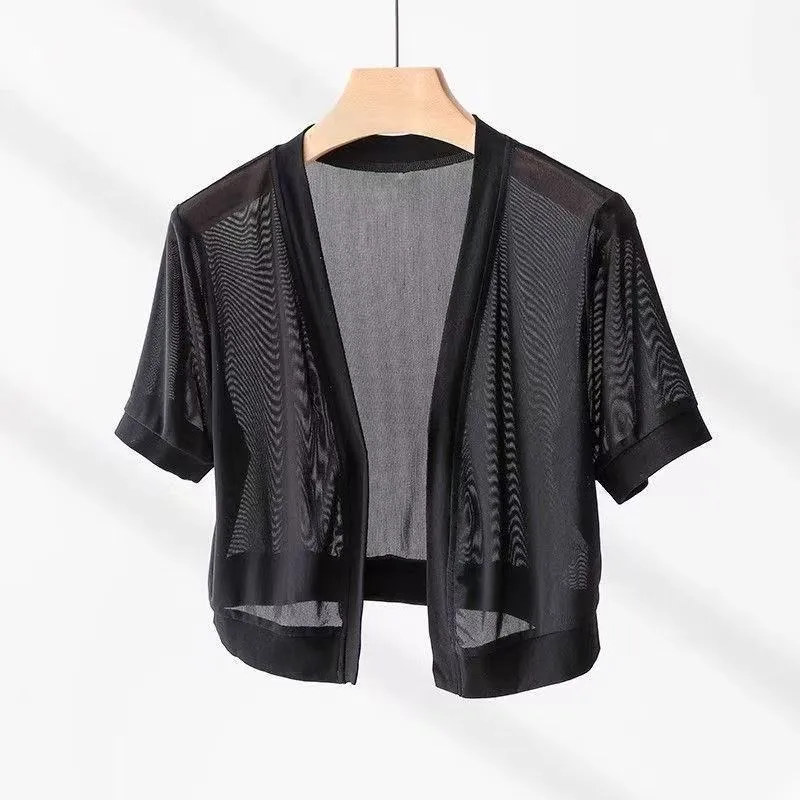 Women's black French-style shirt with long bell sleeves, an irregular collar, and a tied front detail.