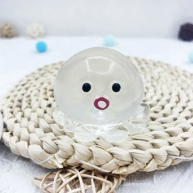 Decompression bubble slow rebound compressable musical toy in pink smiley ball design, made from TPR material for children's stress relief and sensory play