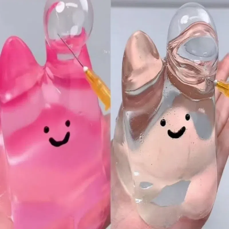 Decompression bubble slow rebound compressable musical toy in pink smiley ball design, made from TPR material for children's stress relief and sensory play