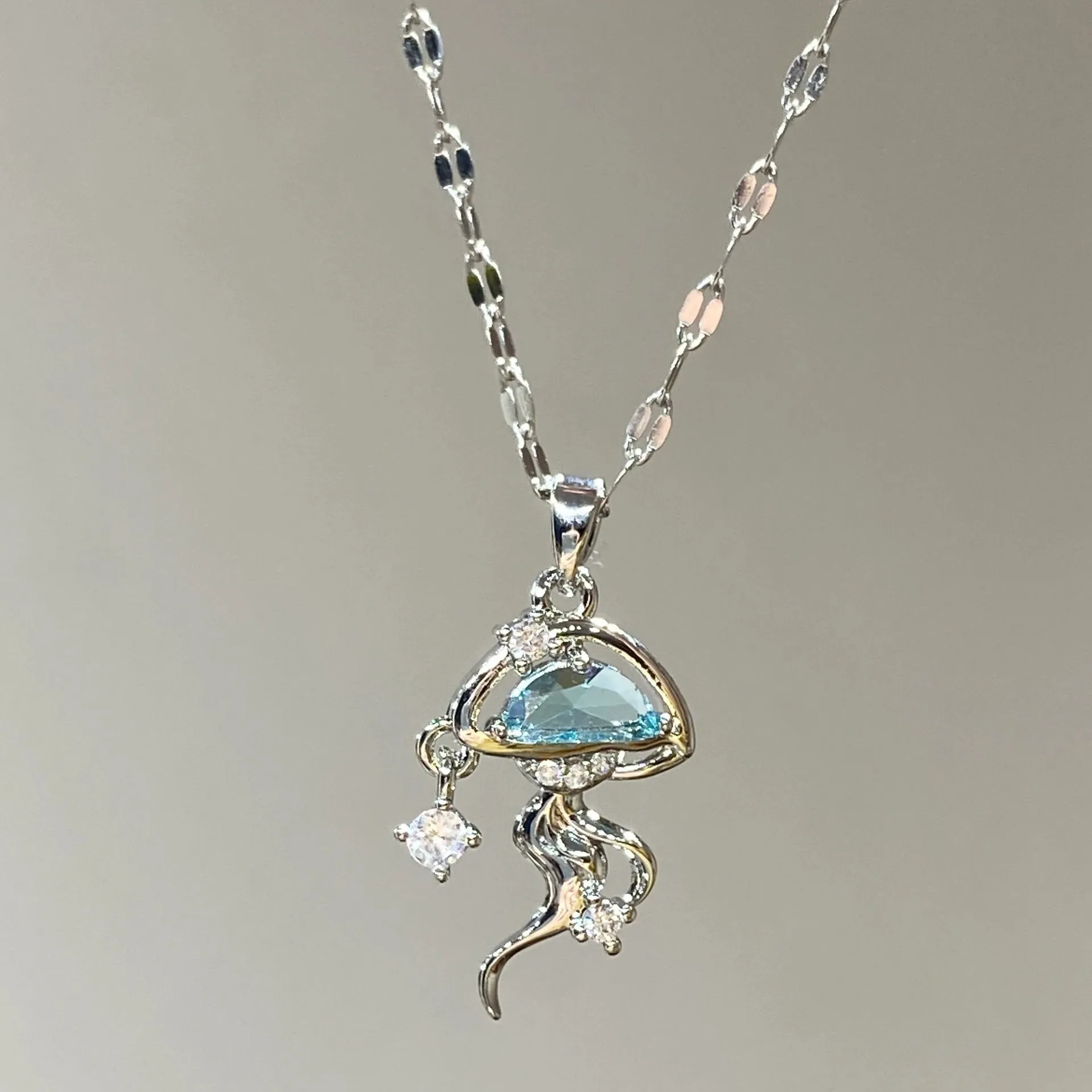 Blue jellyfish charm on sterling silver necklace with adjustable chain
