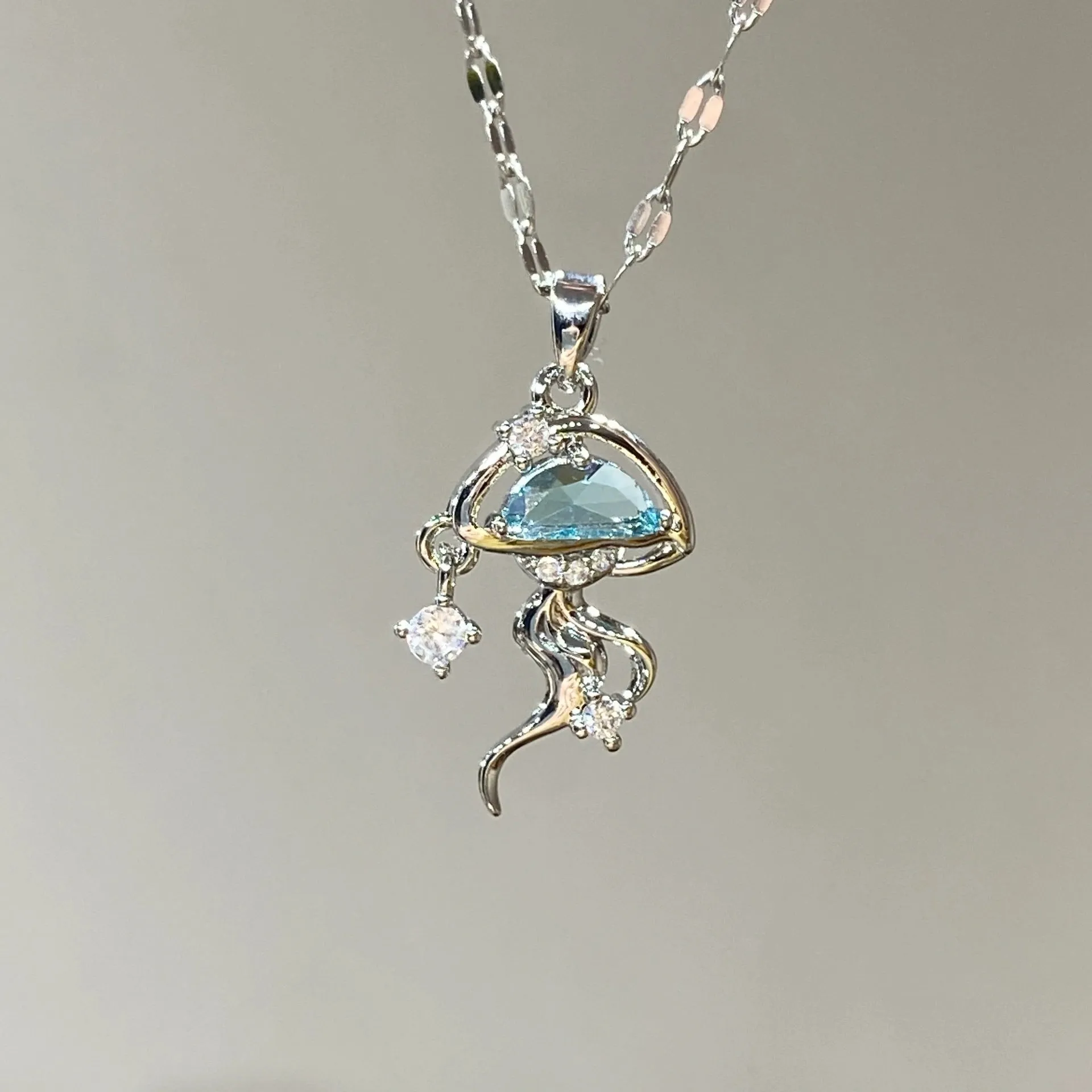 Blue jellyfish charm on sterling silver necklace with adjustable chain