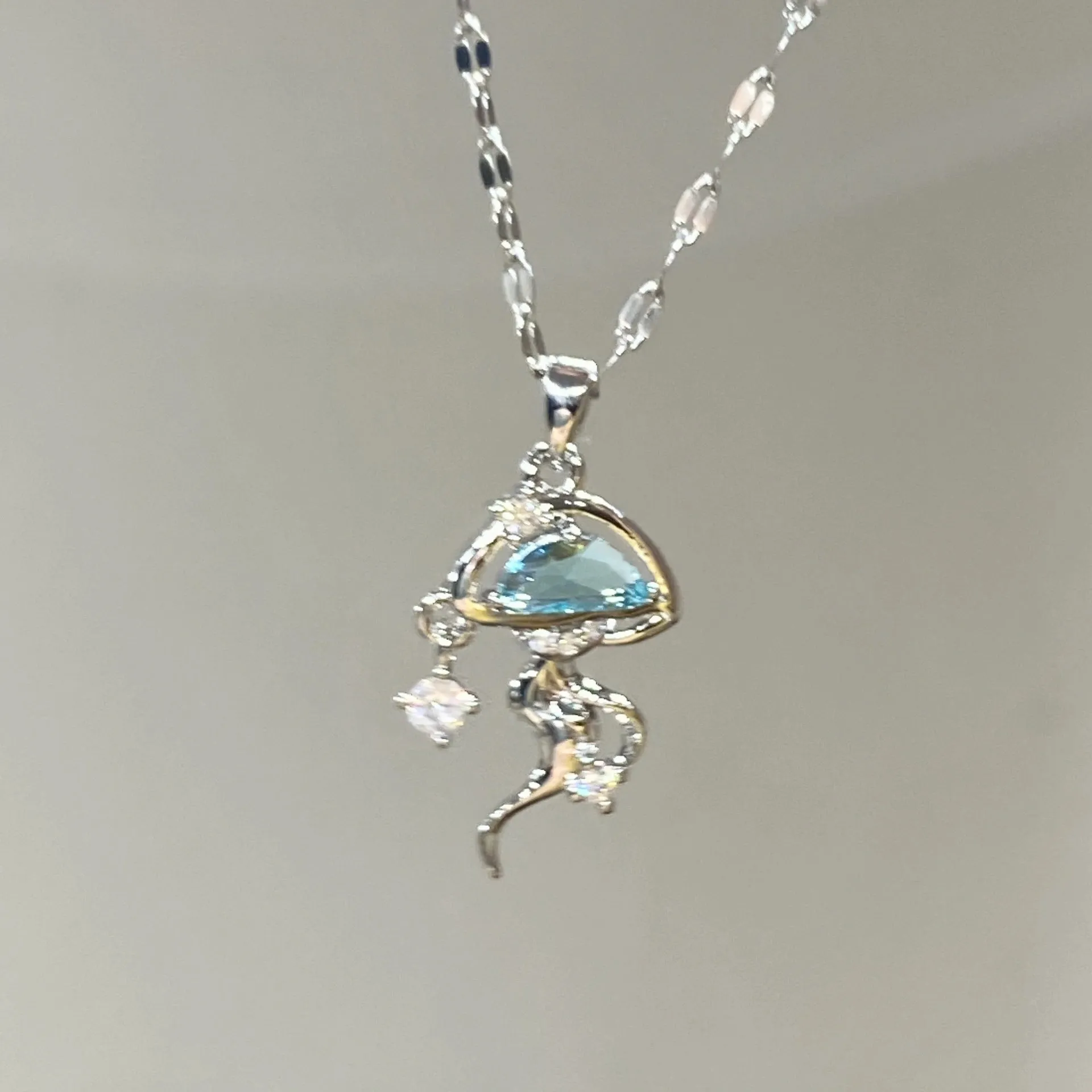 Blue jellyfish charm on sterling silver necklace with adjustable chain