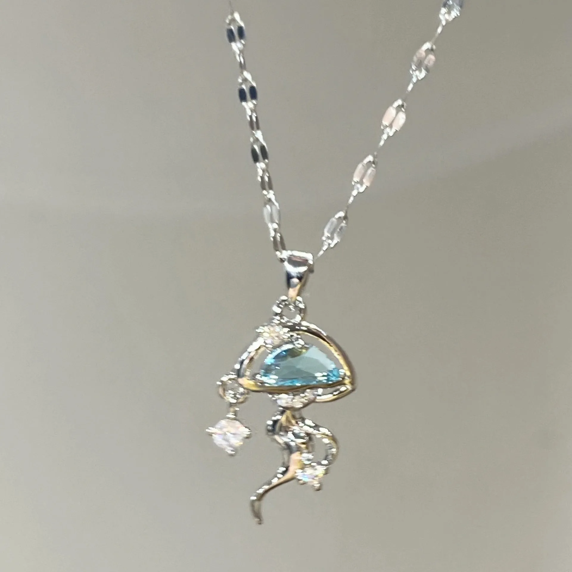 Blue jellyfish charm on sterling silver necklace with adjustable chain