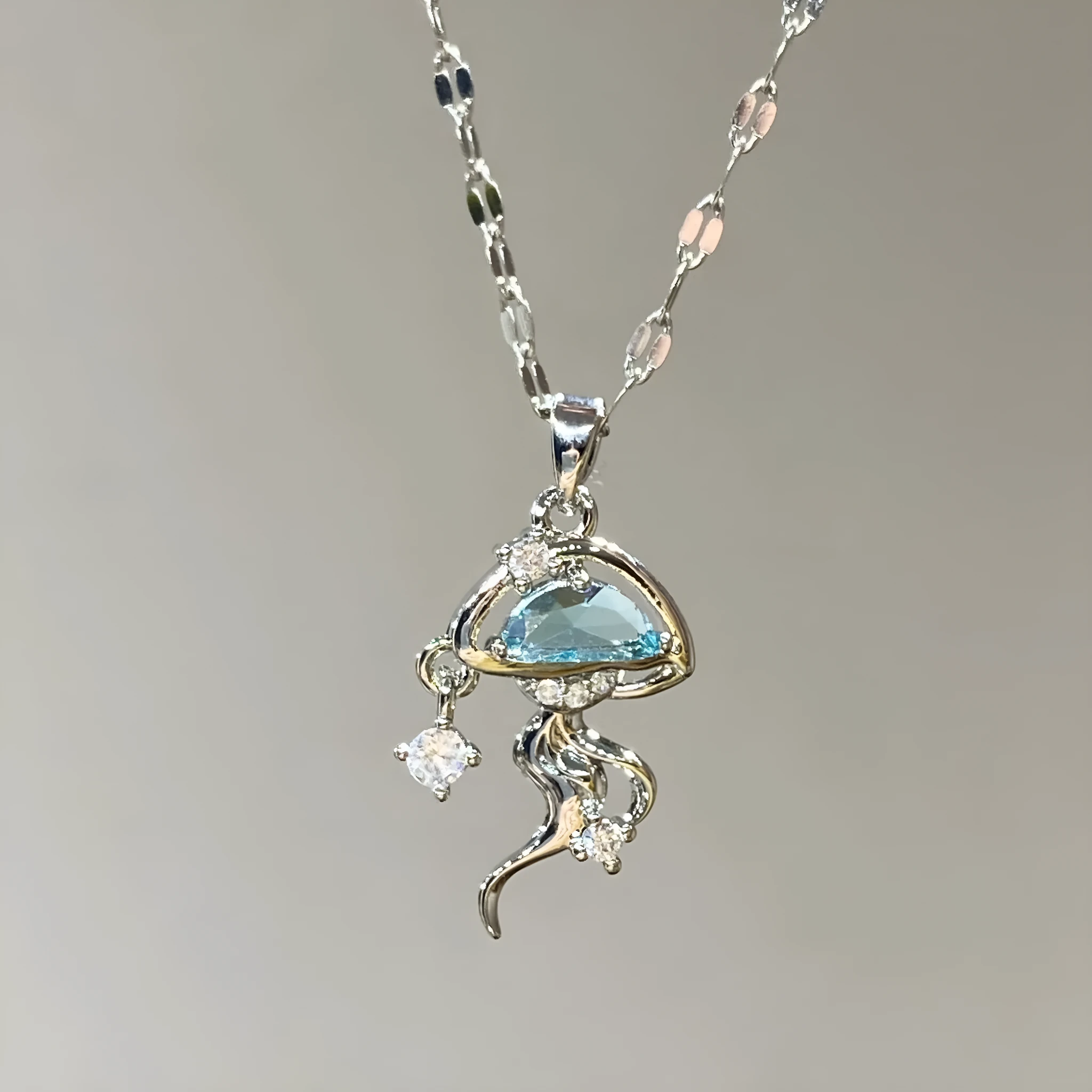 Blue jellyfish charm on sterling silver necklace with adjustable chain