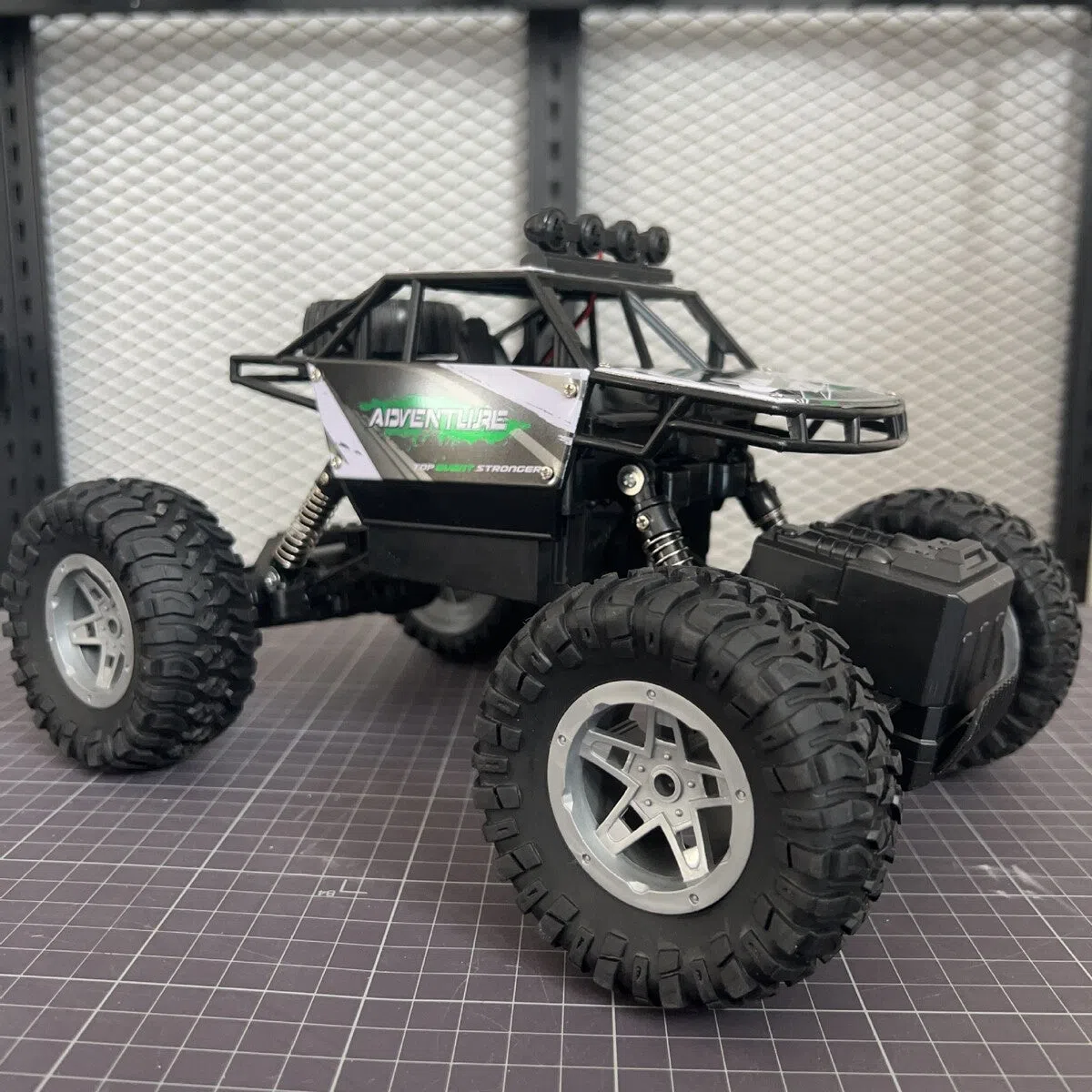 Children's remote control off-road model car in fire blue with four-wheel drive and rechargeable battery