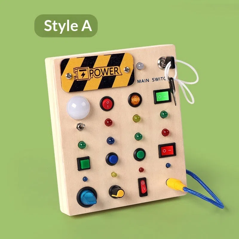 Wooden busy switch light toy on a table, showing switch panel and coloured light section.