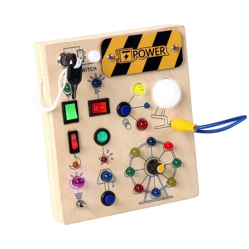 Wooden busy switch light toy on a table, showing switch panel and coloured light section.