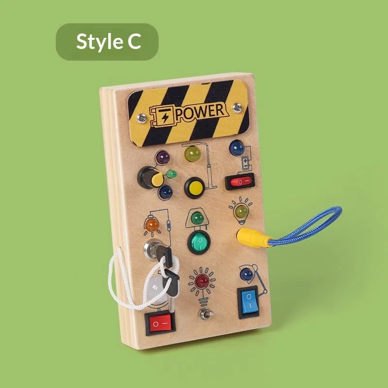 Wooden busy switch light toy on a table, showing switch panel and coloured light section.