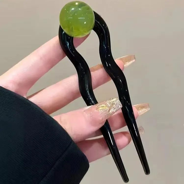 U-shaped hair barrettes with ball decoration in beige, caramel, dark gray and green colour options