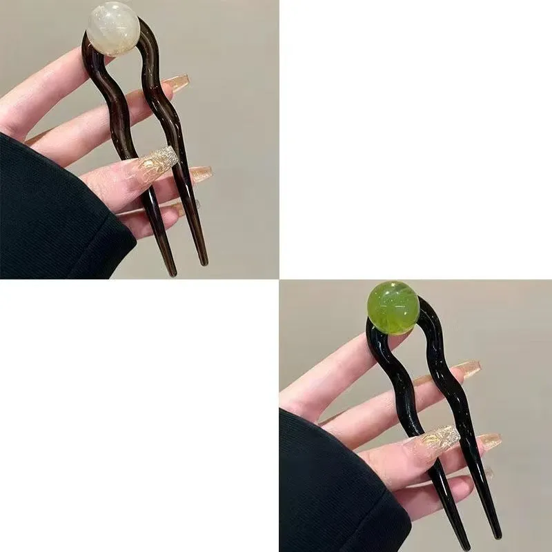 U-shaped hair barrettes with ball decoration in beige, caramel, dark gray and green colour options