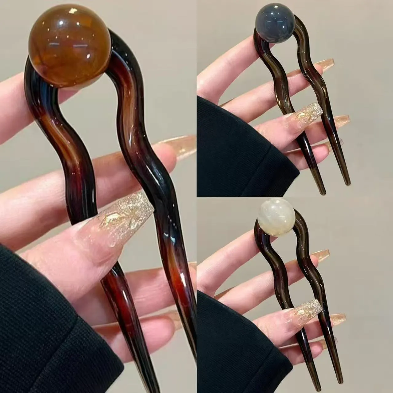 U-shaped hair barrettes with ball decoration in beige, caramel, dark gray and green colour options