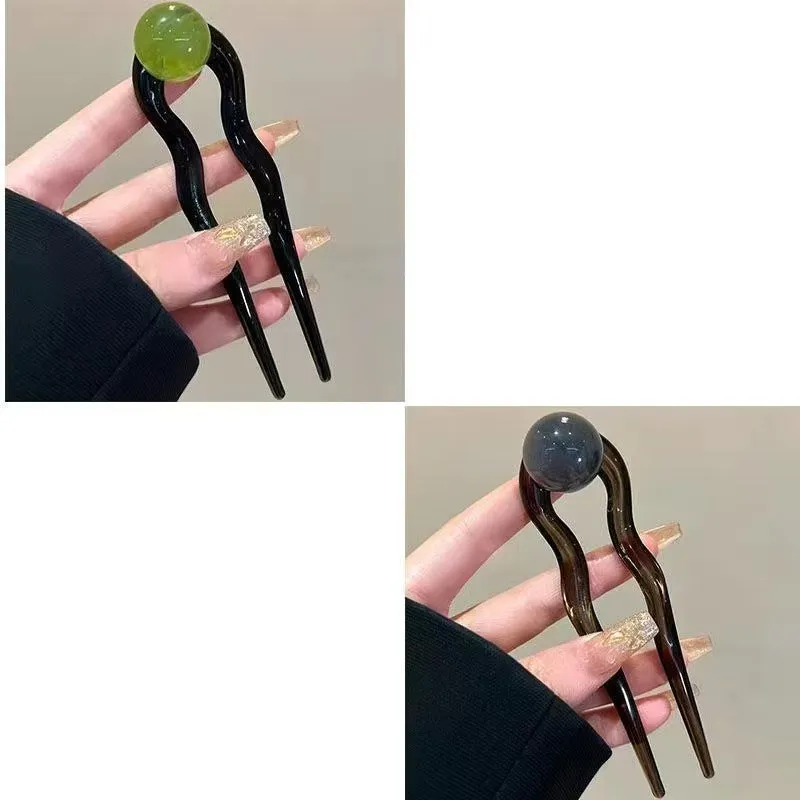 U-shaped hair barrettes with ball decoration in beige, caramel, dark gray and green colour options