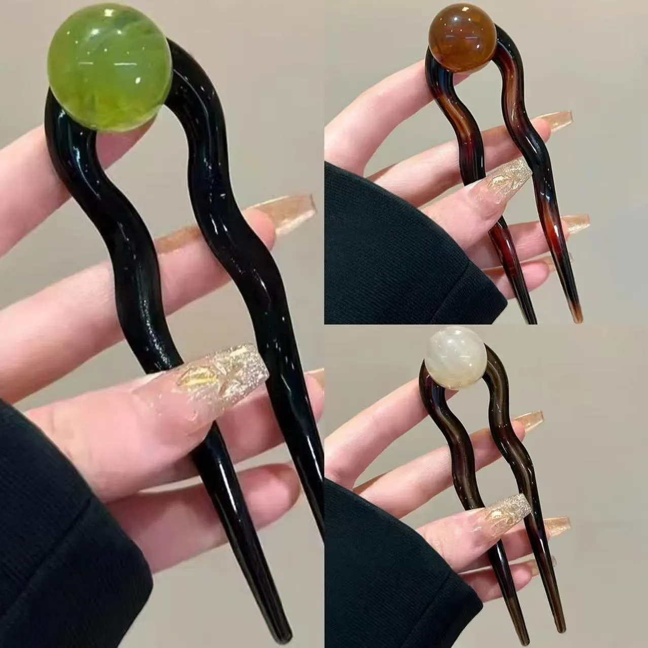 U-shaped hair barrettes with ball decoration in beige, caramel, dark gray and green colour options