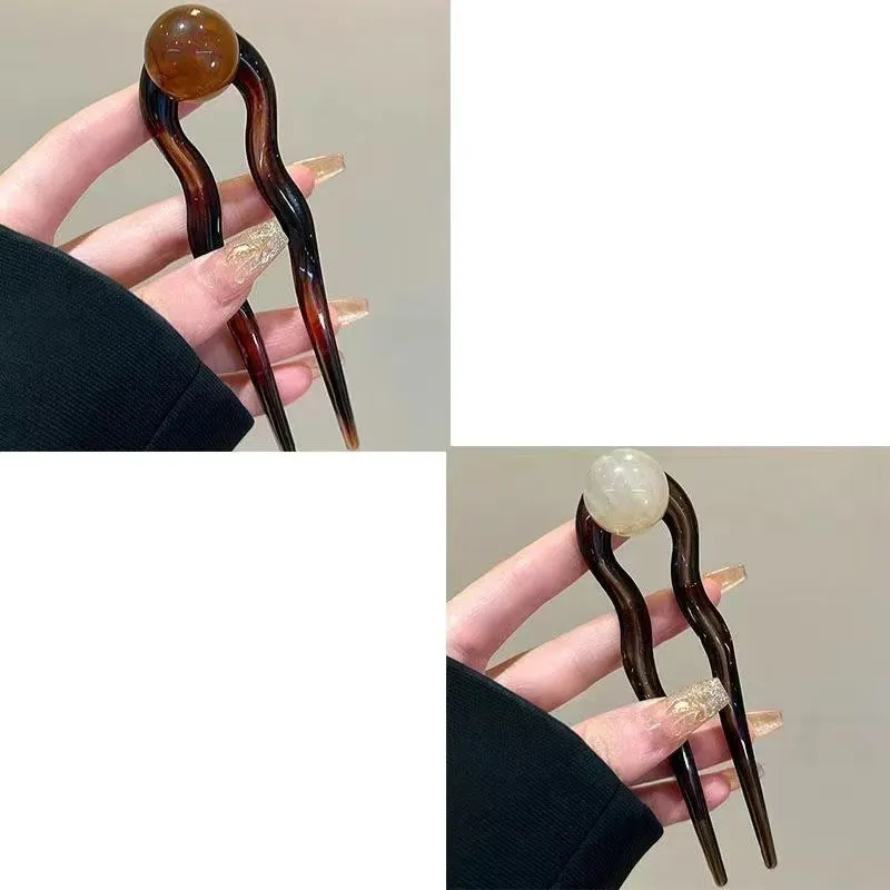 U-shaped hair barrettes with ball decoration in beige, caramel, dark gray and green colour options
