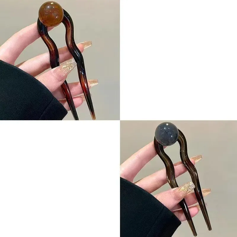 U-shaped hair barrettes with ball decoration in beige, caramel, dark gray and green colour options
