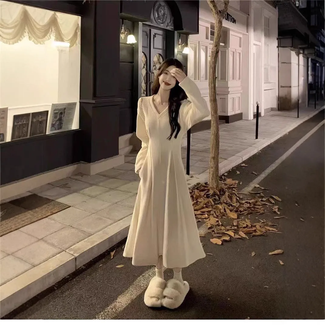 Women's knitted V-neck dress with princess sleeves and long skirt in Milky White or Black.