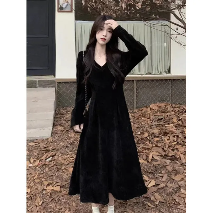 Women's knitted V-neck dress with princess sleeves and long skirt in Milky White or Black.