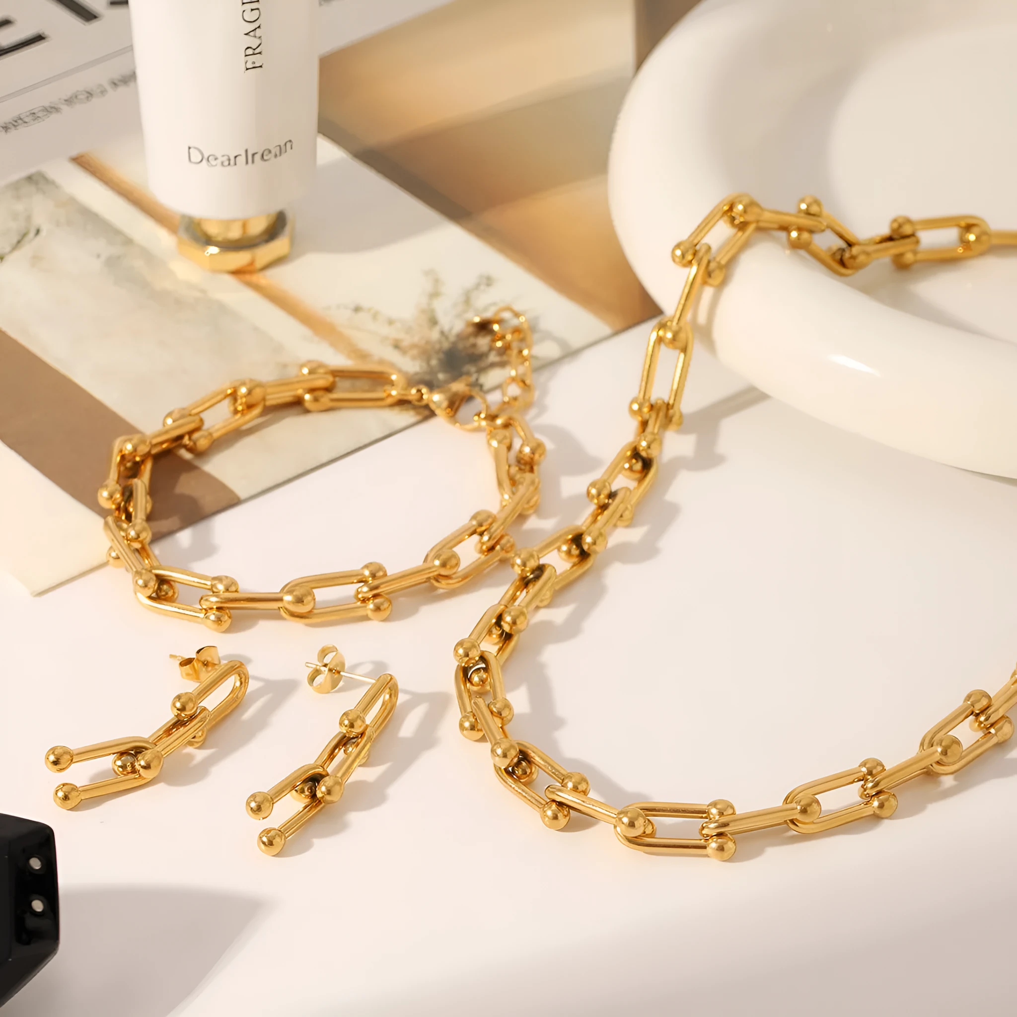 Stainless steel necklace, bracelet, and earring set with a titanium steel horseshoe pendant.
