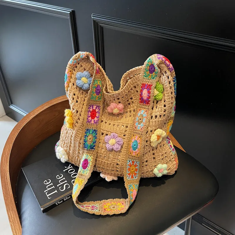 Women's casual white woven hollow beach bag with single shoulder strap on a sandy beach.