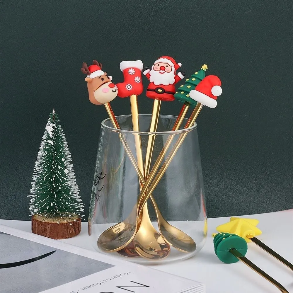 Red stainless steel Christmas spoon and fork set with snowman and Christmas tree designs on the handles.