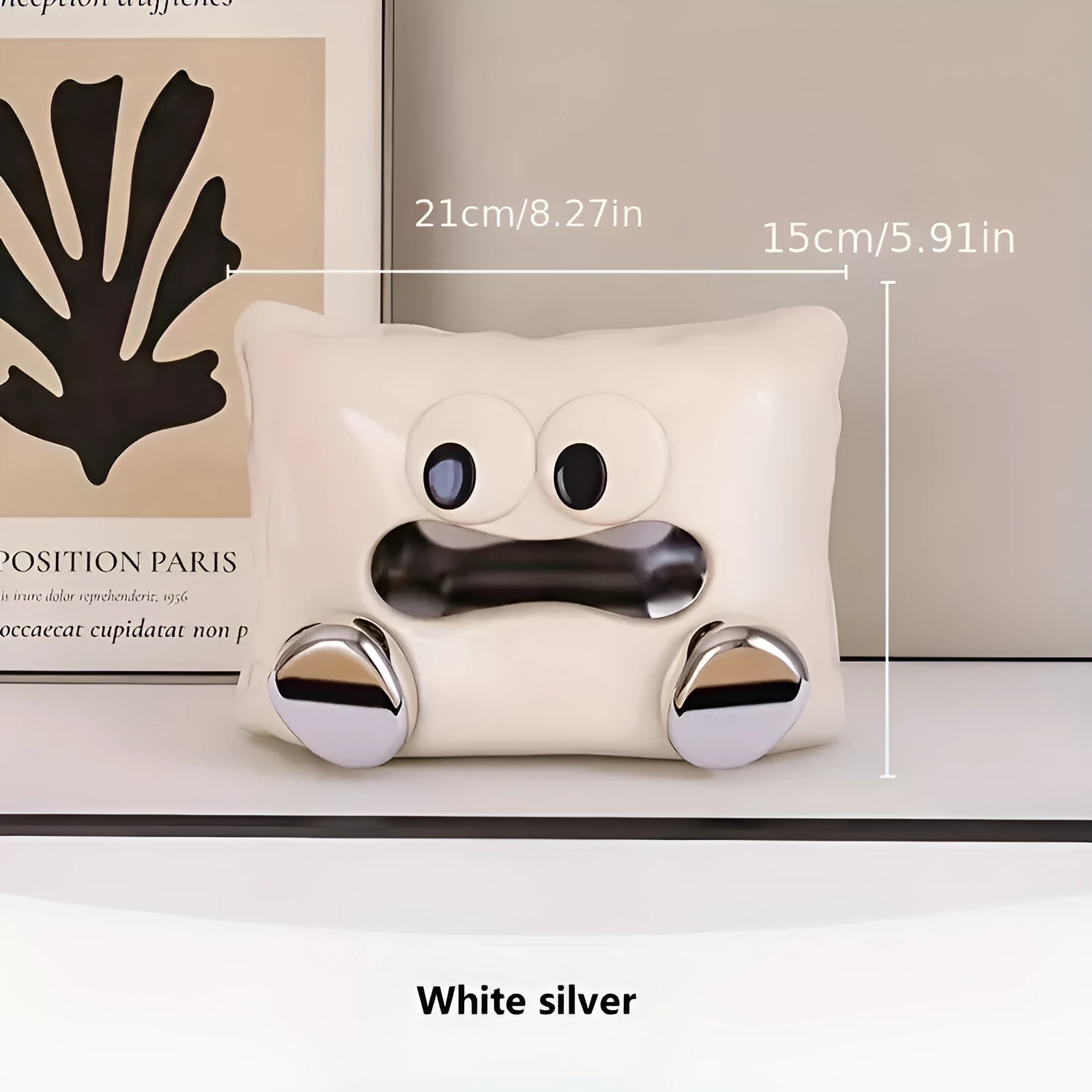 White ceramic tissue box with a smooth, glazed finish on a wooden coffee table.