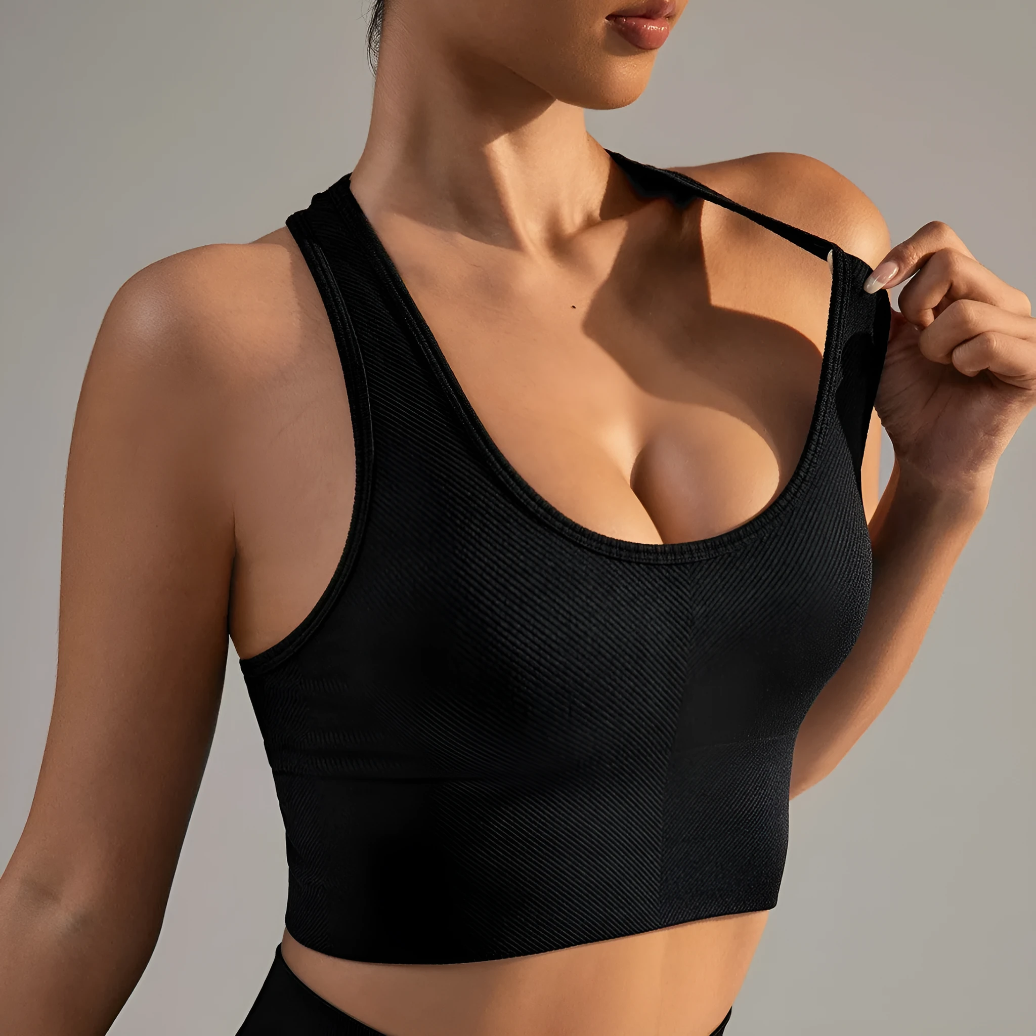 Black cross-back sports bra with quick-dry nylon fabric for running and yoga support