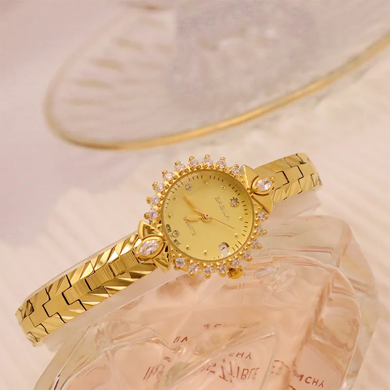 Women's vintage-style quartz watch with diamond-embossed dial and gold metal bracelet