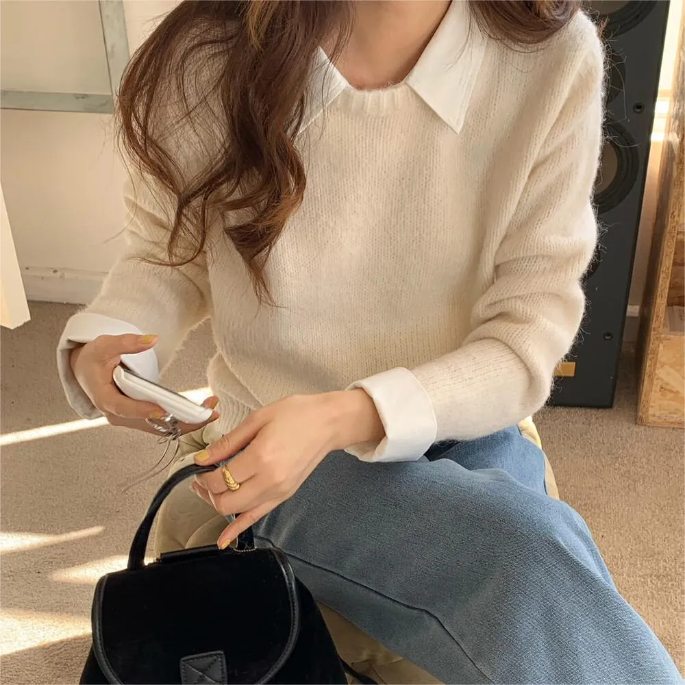 Women's loose knitwear top in navy blue with long sleeves and solid colour design