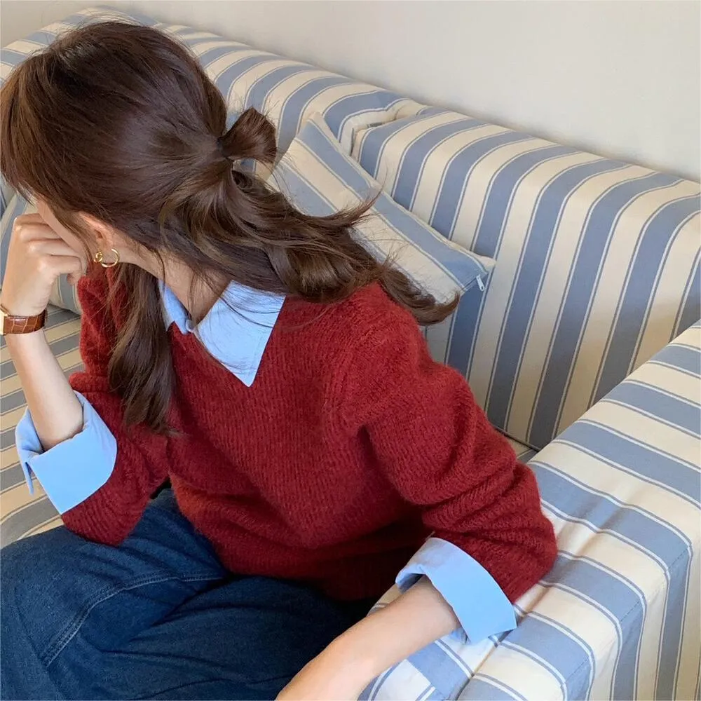 Women's loose knitwear top in navy blue with long sleeves and solid colour design