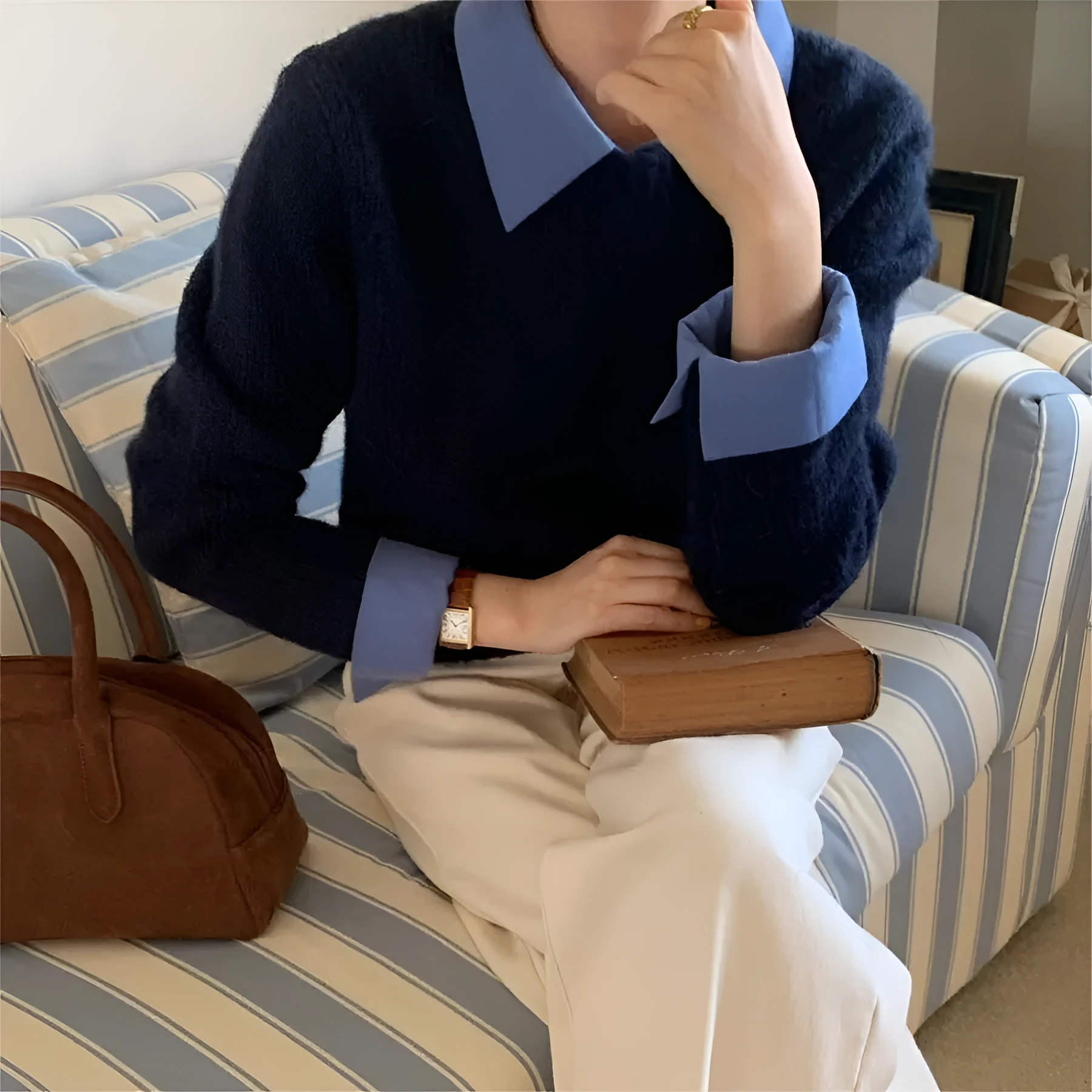Women's loose knitwear top in navy blue with long sleeves and solid colour design