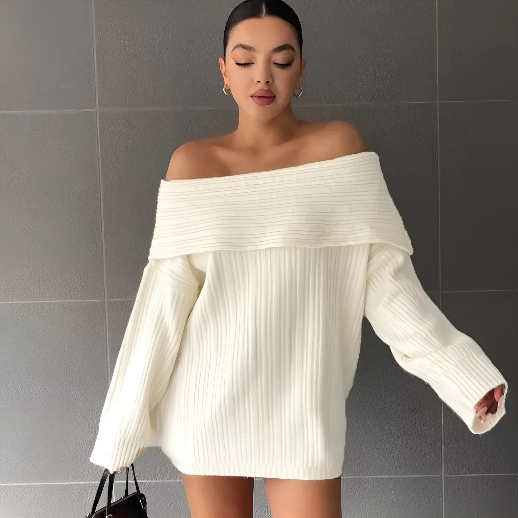 Women's loose long sleeve acrylic pullover sweater in white, shown laid flat.