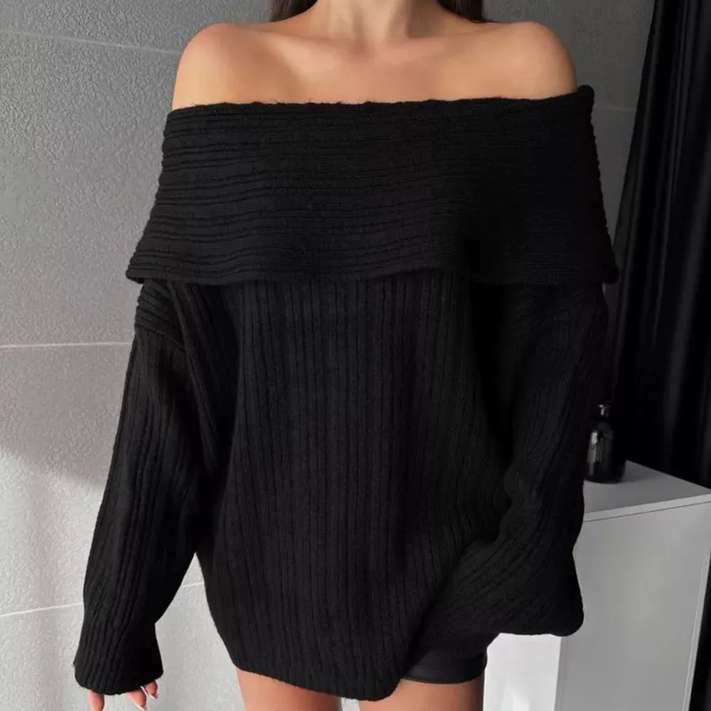 Women's loose long sleeve acrylic pullover sweater in white, shown laid flat.