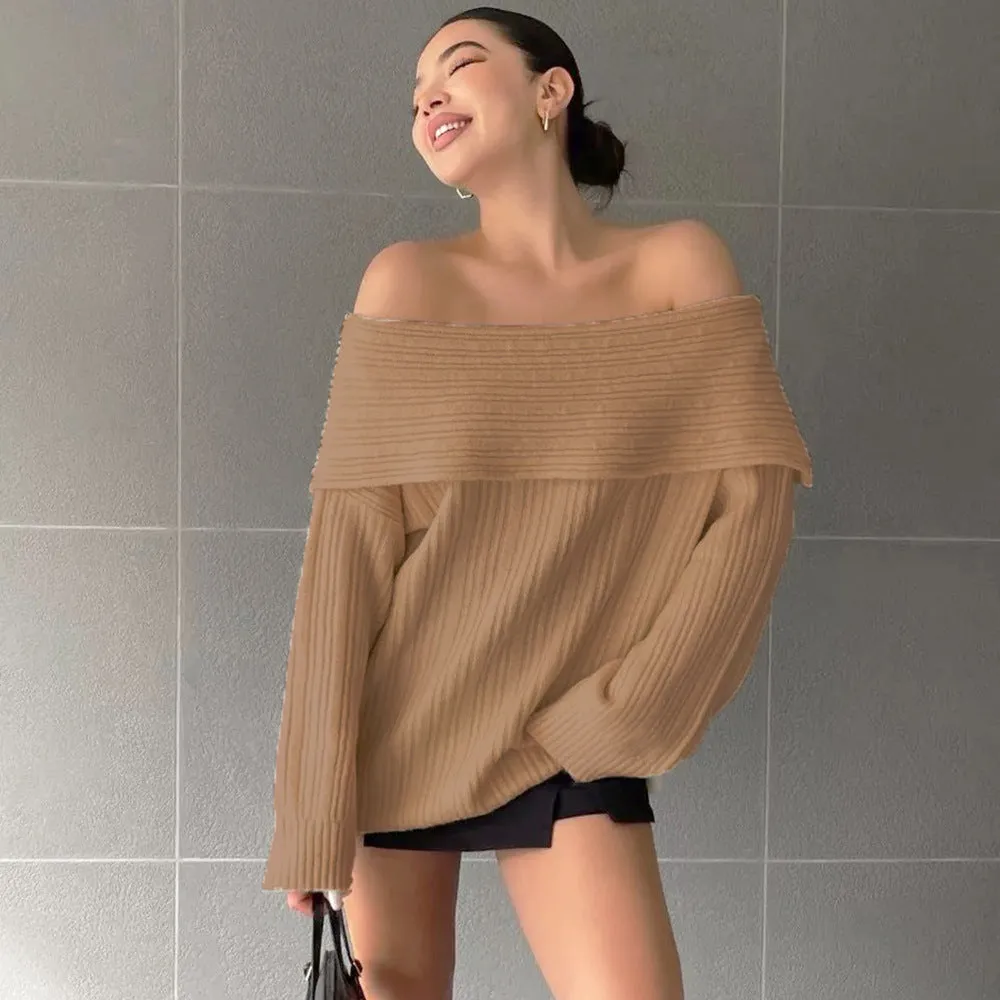 Women's loose long sleeve acrylic pullover sweater in white, shown laid flat.