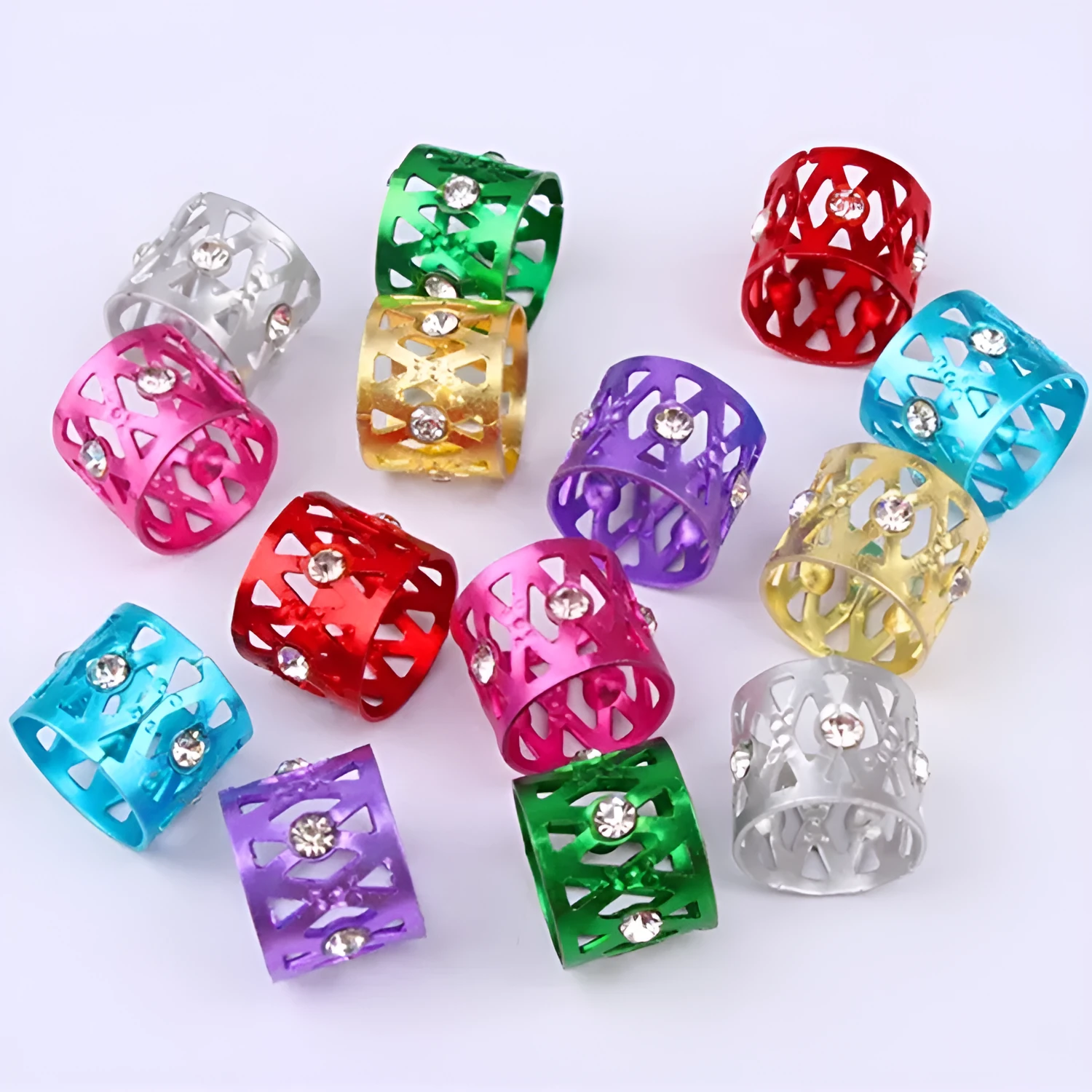 Aluminium wig decoration hair ring with jeweled details in multiple colour options on a white background.
