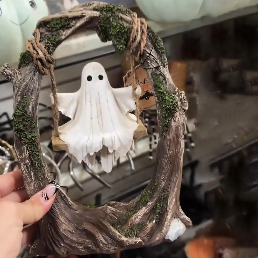 Halloween swing ghost decoration in resin showing two style options with modern art design