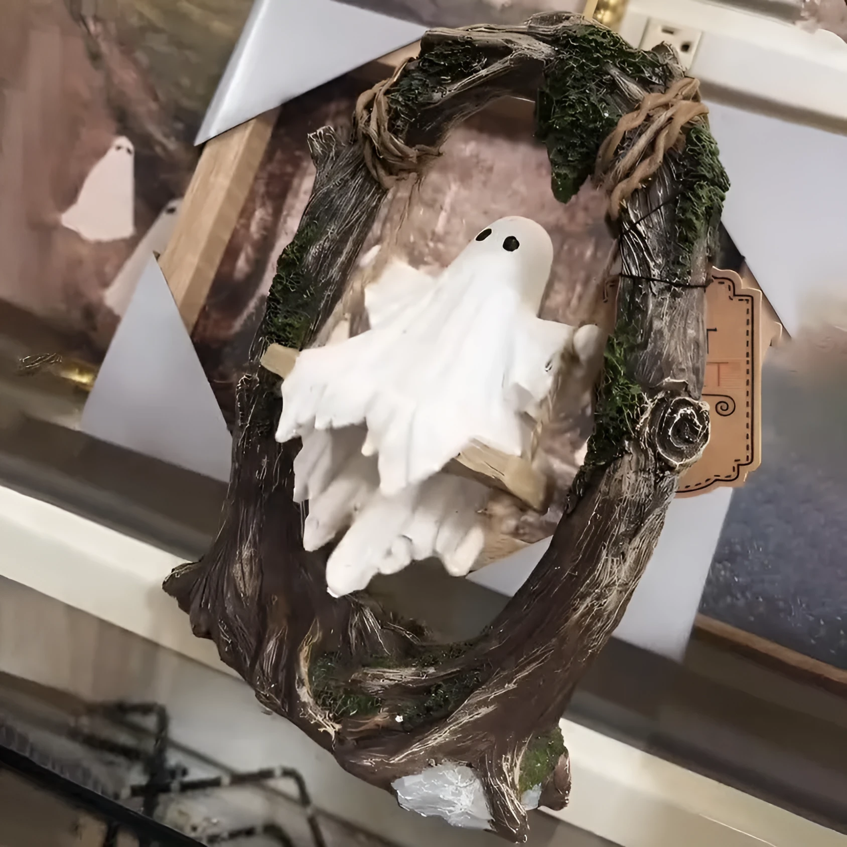 Halloween swing ghost decoration in resin showing two style options with modern art design