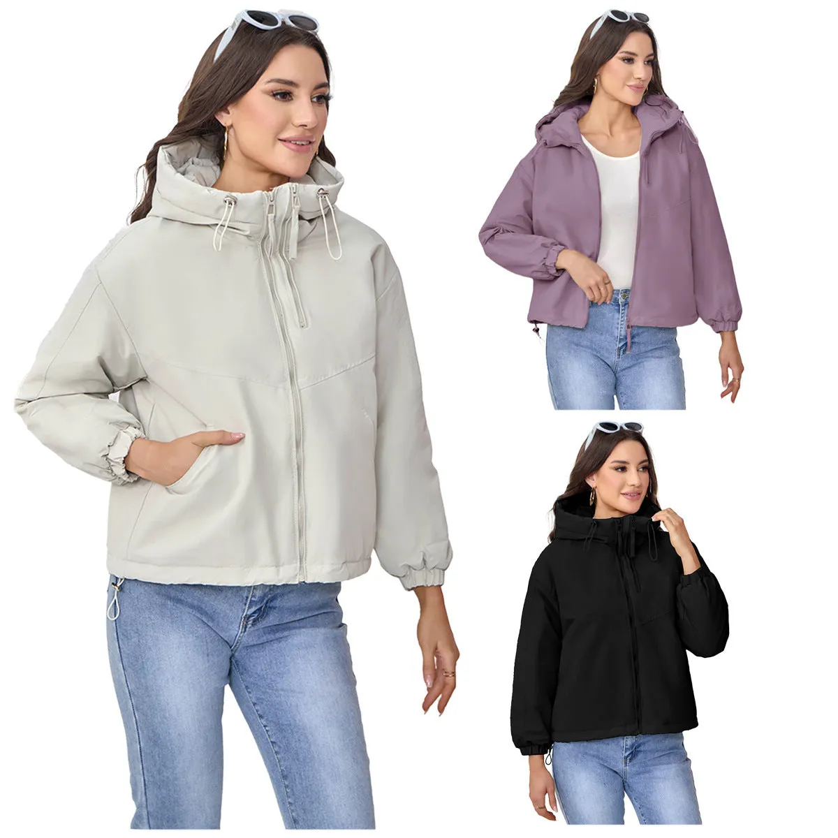 Grey women's loose-fit hooded polyester shell jacket with long sleeves on a hanger.