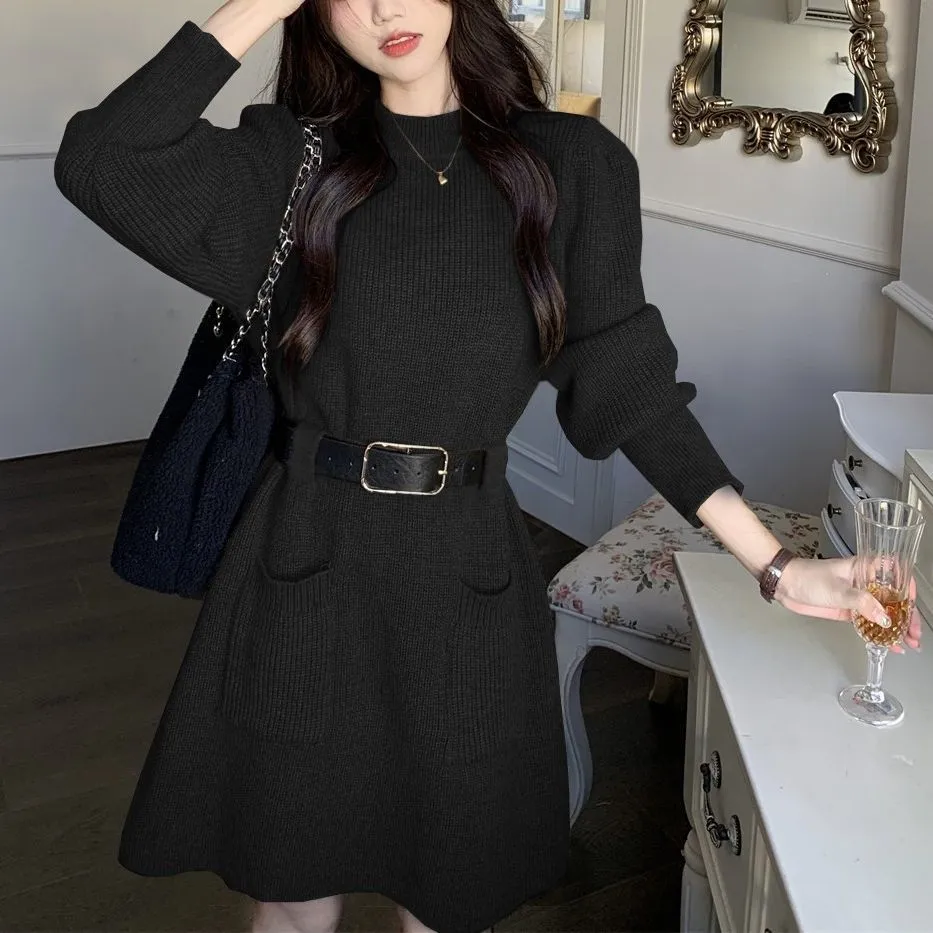 Women's loose knitted dress with long sleeves and high waist, shown in beige with black belt