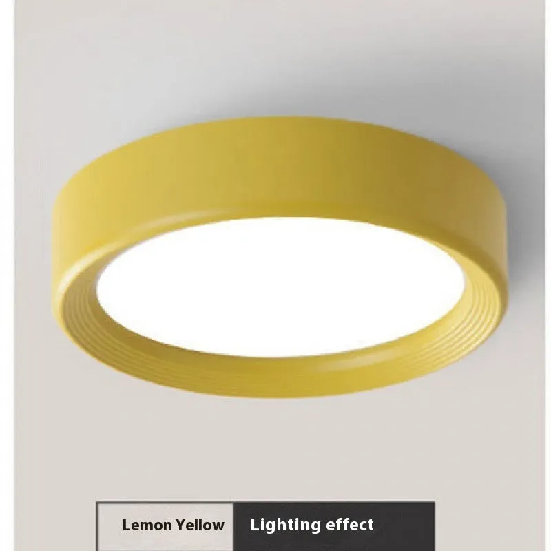 Ultra-thin surface mounted LED downlight in multiple shell colour options.