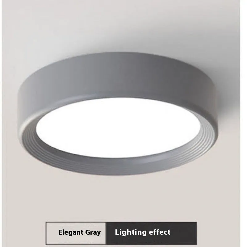 Ultra-thin surface mounted LED downlight in multiple shell colour options.