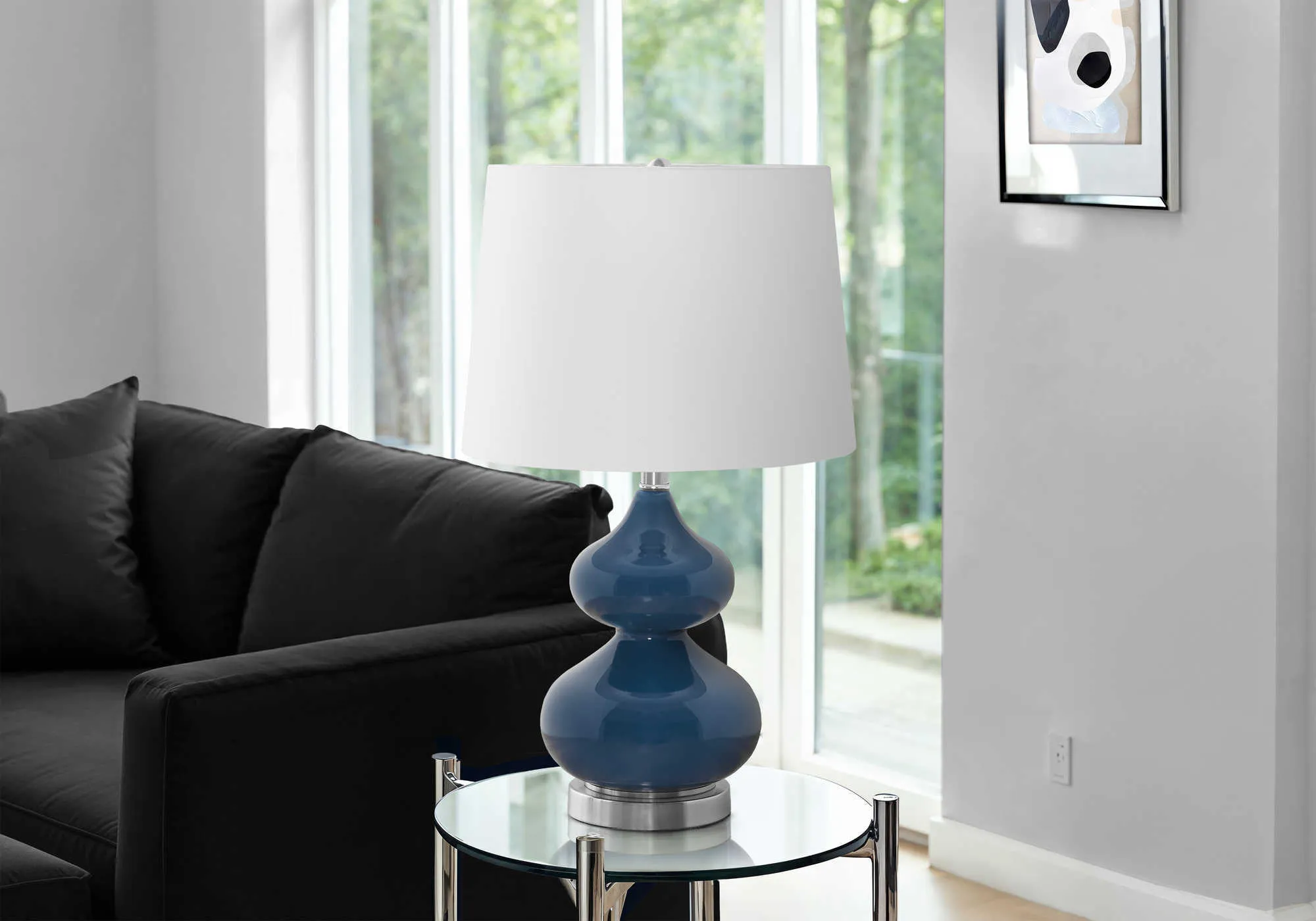 Blue crystal glass desk lamp with a cloth shade for a child's bedroom, shown on a desk.