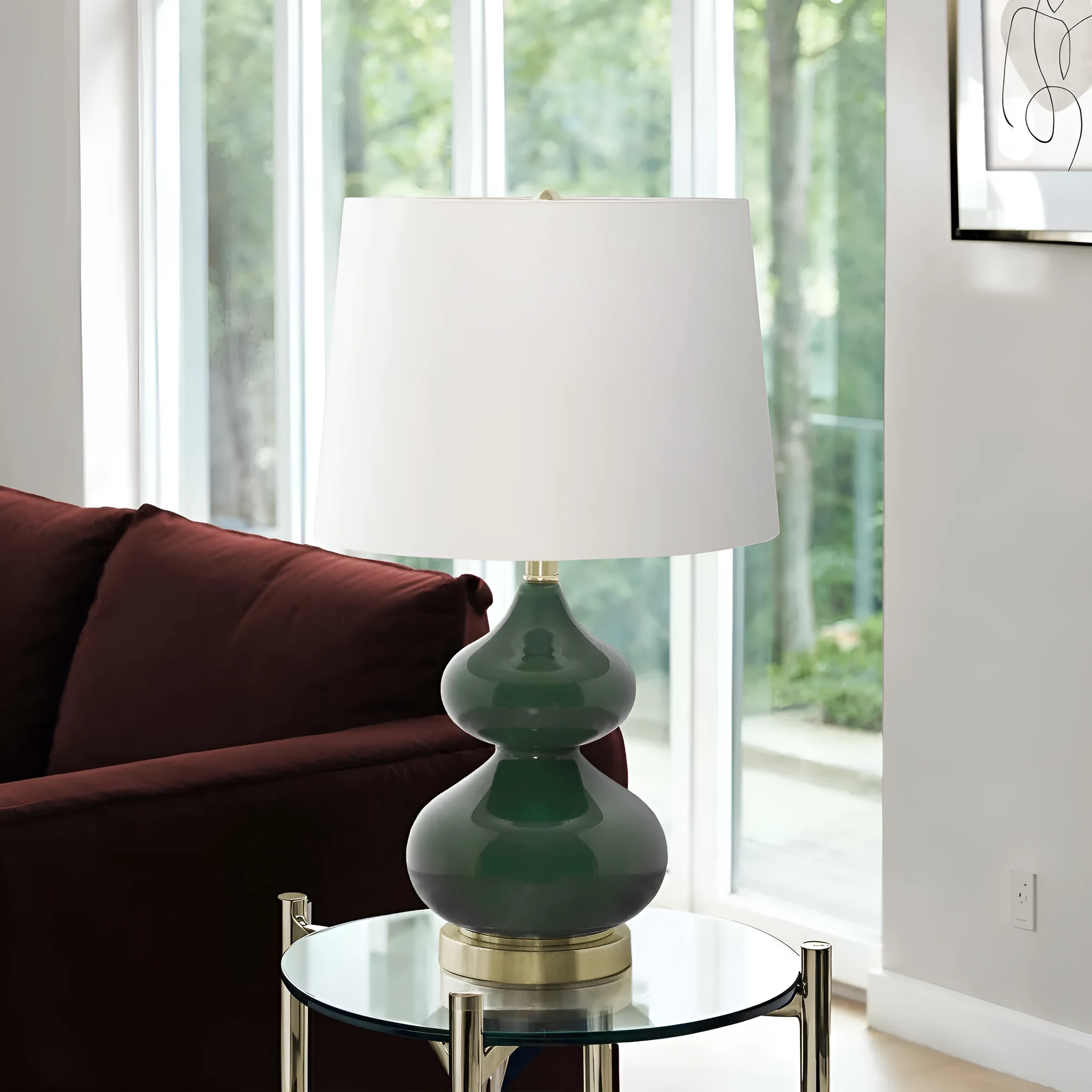 Blue crystal glass desk lamp with a cloth shade for a child's bedroom, shown on a desk.