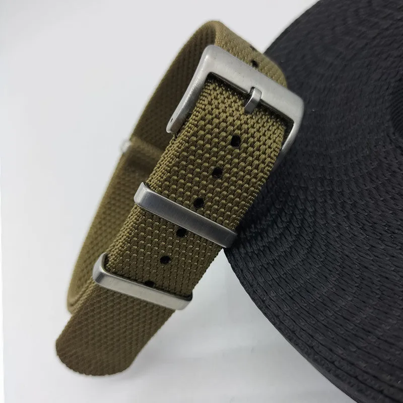 Nylon integrated watch strap in army green colour showing textile weave and buckle.