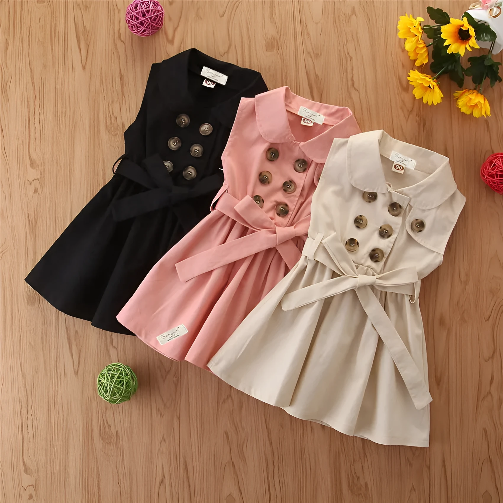 Sleeveless cotton A-line princess dress for a young girl, shown in pink.