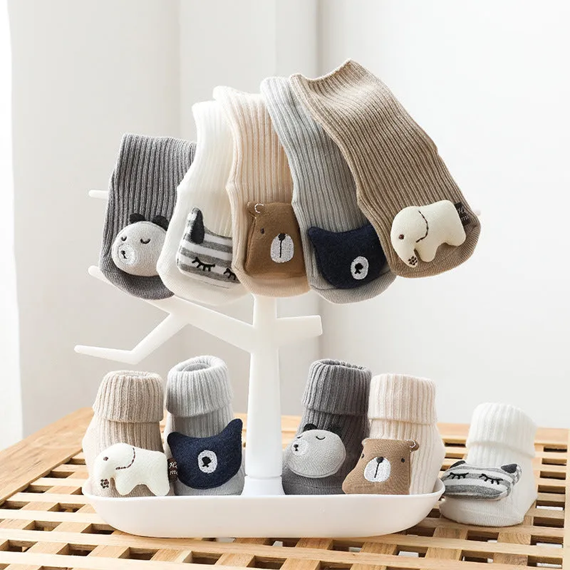 Baby socks with anti-slip dispensing glue in combed cotton, shown in multiple colours including blue bear print and pink cat.