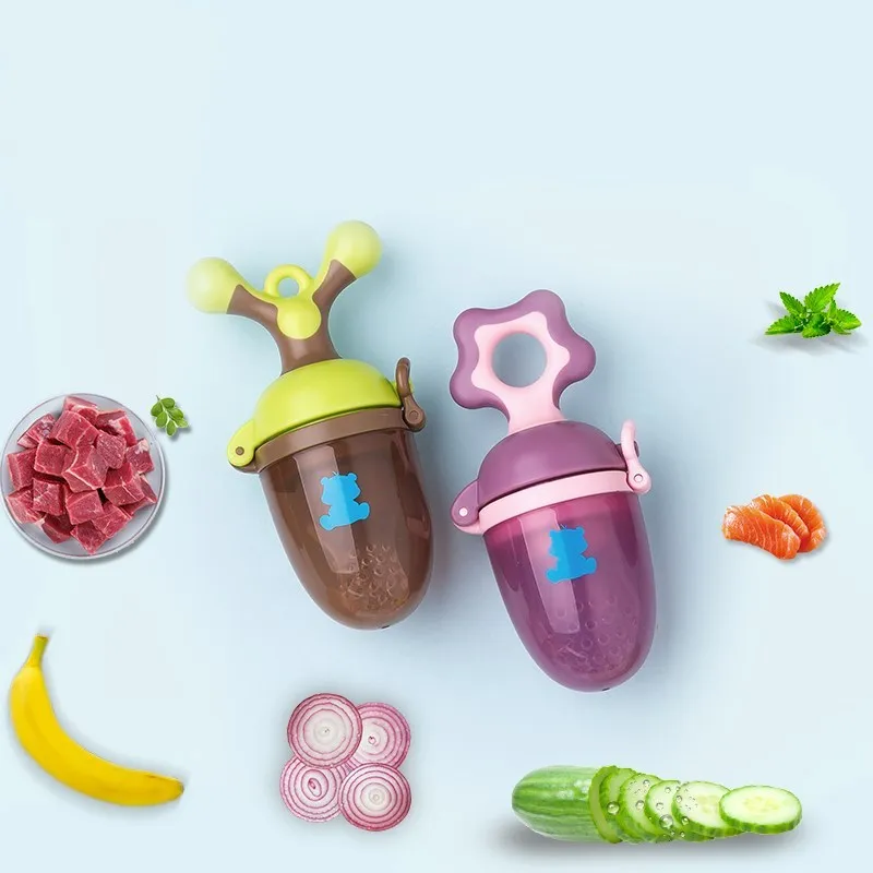 Green and purple polypropylene baby bite trainer with textured surface and easy-grip handle