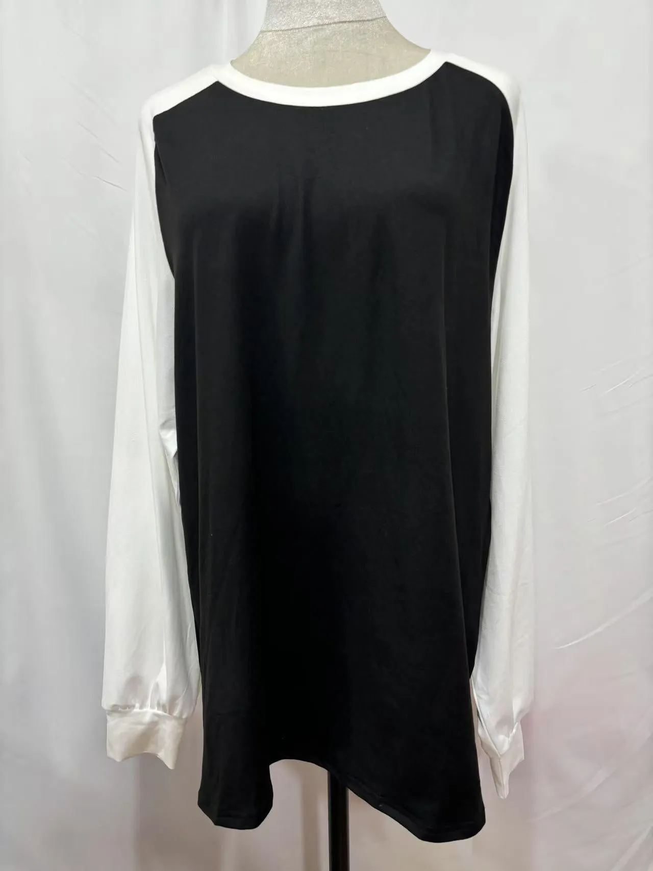 A casual long sleeve round neck T-shirt in a solid colour, shown flat to display its simple design.